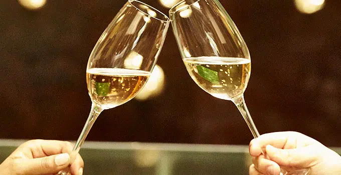 cheers with glass of champagne