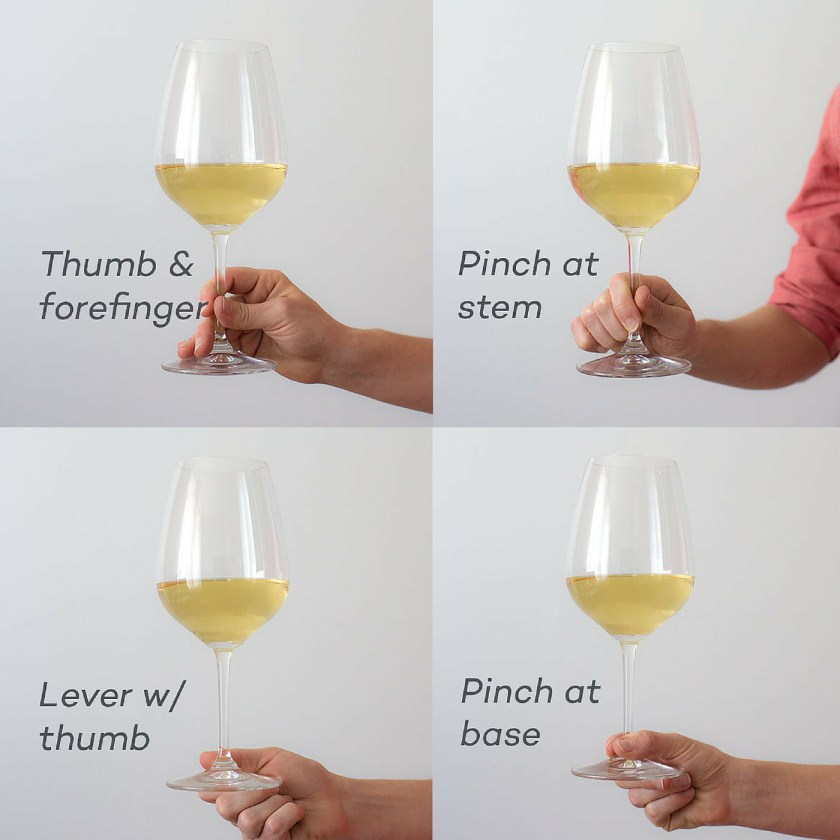 someone holding a glass of wine