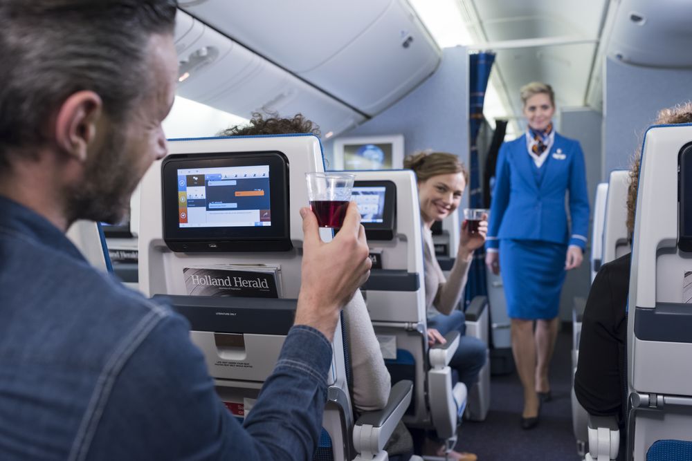 an air hostess serving on a plane