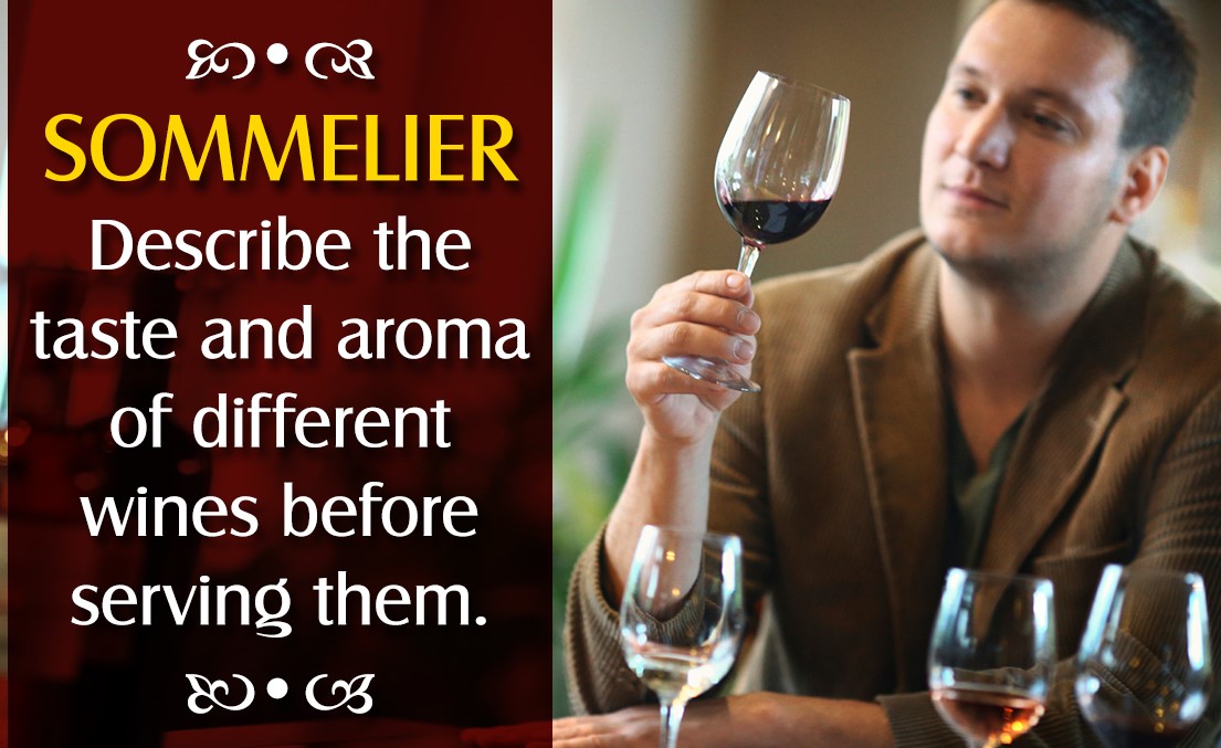 A Sommelier holding a glass of wine