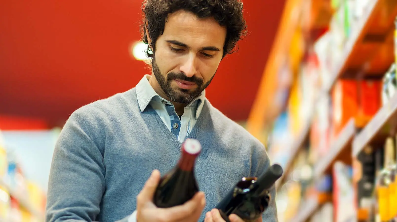 a man holding a wine bottle