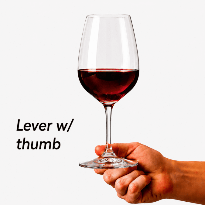 Holding a red wine glass using thumb support